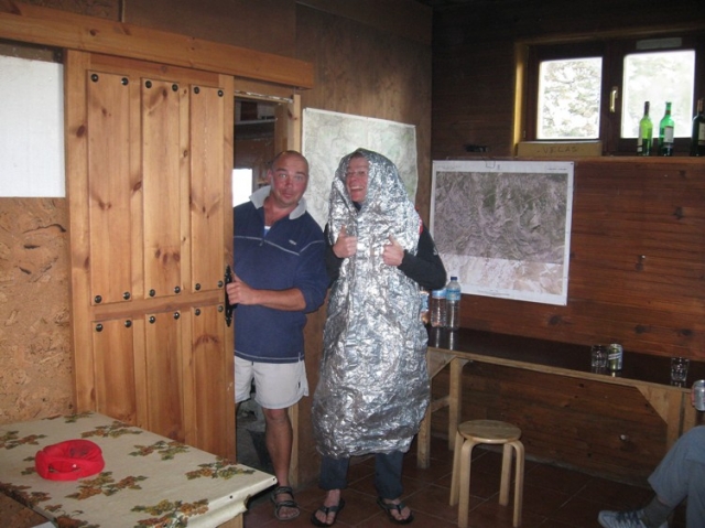 Martin tries out Mike's survival bag in the comfort of the Andara hut